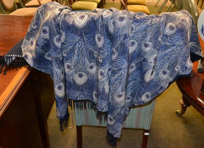 Lot 441 - A large Liberty peacock patterned cotton wrap/shawl, with navy blue wool reverse