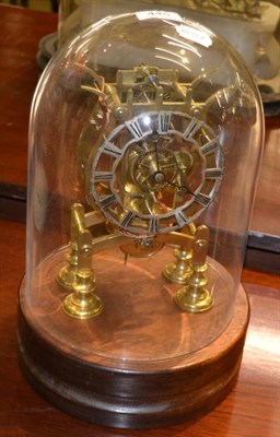 Lot 445 - Brass skeleton mantel time piece, beneath a glass dome