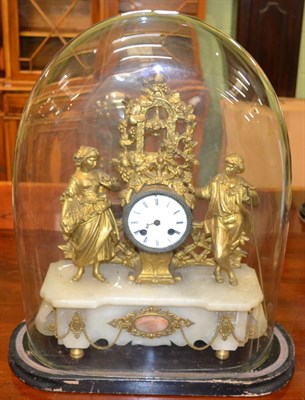 Lot 447 - A gilt metal striking mantel clock, beneath a glass dome