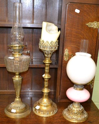 Lot 450 - Two Victorian brass oil lamps, one with clear glass reservoir the other pink glass together...