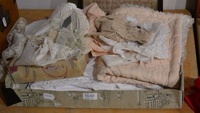 Lot 1030 - Assorted early 20th century textiles, including nursery cot cover, toddler dresses, lace and...