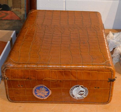 Lot 1032 - A mid 20th century brown crocodile style suitcase, with checked fabric internal lining and...