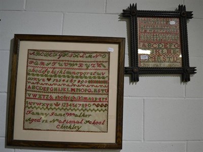 Lot 1038 - Framed 19th century alphabet sampler by Christina E Hutton, worked in red and green in a carved oak