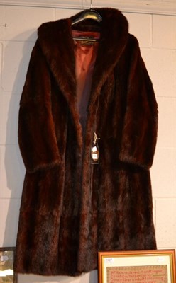 Lot 1042 - A brown mink coat, with receipt