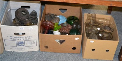 Lot 1142 - Three boxes of various glass oil lamp reservoirs, burners and funnels etc