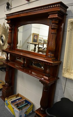 Lot 1181 - A mahogany fire surround with integral over mantle mirror