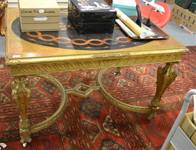 Lot 1212 - A 19th century carved giltwood centre table, with inset polished slate and aventurine oval top,...