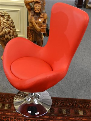 Lot 1217 - A modern chrome and leather swivel chair