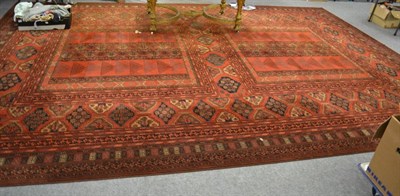 Lot 1218 - A machine made carpet of Ersari Ensi design, central field surrounded by geometric conforming...