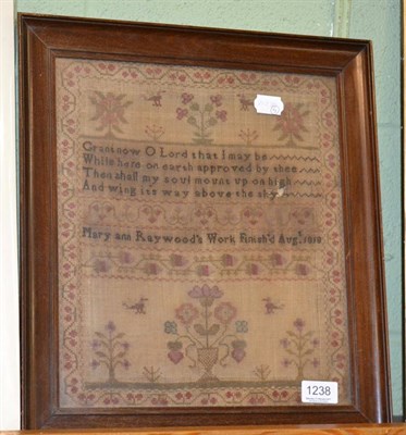 Lot 1238 - Framed sampler worked by Mary Ann Raywood, dated August 1818, with central religious verse,...