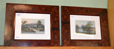 Lot 1253 - A pair of early 20th century Chinese watercolour landscapes in lacquer frames