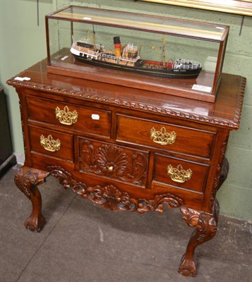 Lot 1277 - A carved reproduction lowboy