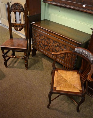 Lot 1290 - An oak carved blanket chest, corner chair and a single oak chair (3)