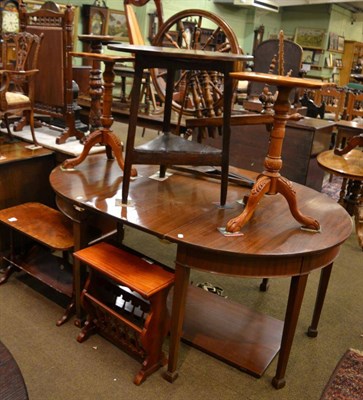 Lot 1299 - A pair of reproduction tripod tables together with two magazine racks