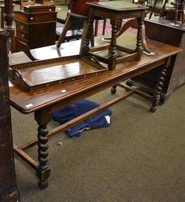 Lot 1311 - An early 20th century oak refectory table with boldly turned legs and joined by a H stretcher