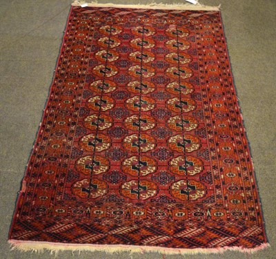 Lot 1324 - A Tekke Turkmen rug, Emirate of Bukhara, the madder field with three columns of quartered...