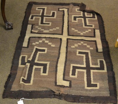 Lot 1326 - Navajo rug, North America, the natural brown field of swastikas enclosed by pale borders, 152cm...