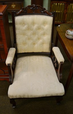 Lot 1328 - An early 20th century beech open armchair, button back, padded arms, carved details, cabriole...