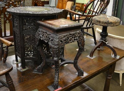 Lot 1354 - An early 20th century ivory inlaid carved middle eastern folding occasional table, together...