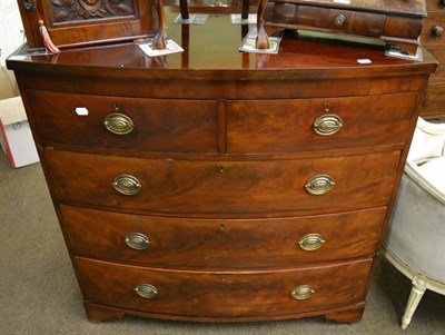 Lot 1356 - A George III mahogany bow fronted four height chest of drawers