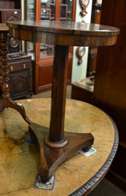 Lot 1372 - A Regency rosewood occasional table, the circular top on a faceted tapering standard raised on...