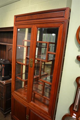 Lot 1382 - A 20th century Chinese glazed display cabinet