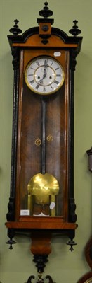 Lot 1392 - A Vienna type striking wall clock, in an ebonised and walnut veneered case, double weight...