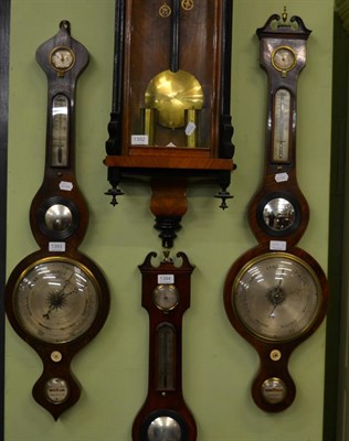 Lot 1393 - A rosewood wheel barometer and a mahogany wheel barometer, both marked 'warranted correct'