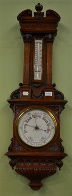 Lot 1400 - A carved oak aneroid barometer, circa 1890