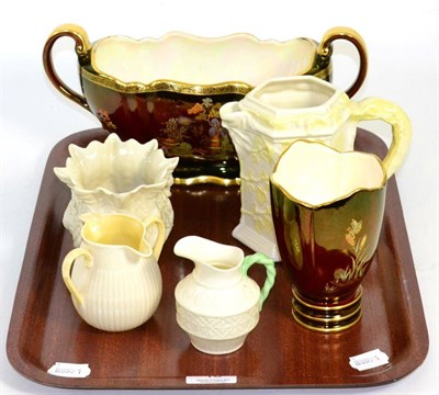 Lot 16 - A Beleek foliate decorated jug, cream jug, milk jug and a small planter together with a Carlton...