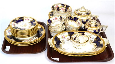 Lot 29 - A Coalport tea service in the 'Batwing' pattern, including two teapots, oval plates etc