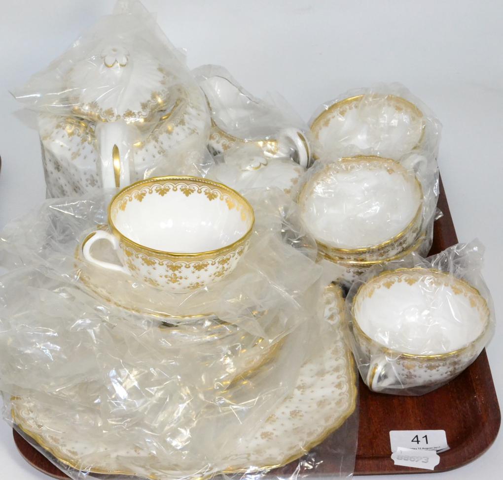 Lot 41 - A Spode Fleur de Lys pattern tea service, including teapot, unused and still in wrappers