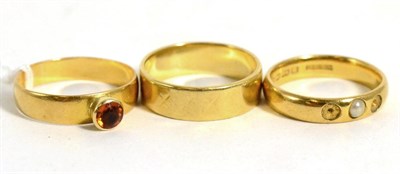 Lot 52 - Two 22ct gold rings and an 18ct gold band ring