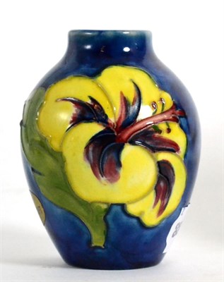 Lot 97 - A Moorcroft pottery small ovoid vase in 'Hibiscus' pattern