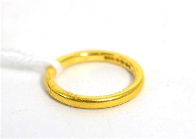 Lot 200 - A 22ct gold band ring, finger size L