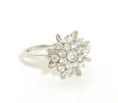 Lot 230 - A 9ct white gold diamond cluster ring, total estimated diamond weight 1.00 carat approximately,...