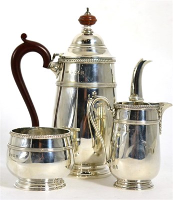 Lot 274 - A Walker & Hall silver three piece coffee set including coffee pot, cream and sugar