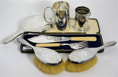 Lot 279 - A silver bottle holder, a three piece silver backed dressing table set, plated tankard and...