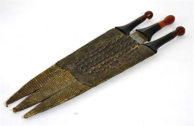 Lot 281 - A set of three Sudanese knives in a crocodile skin scabbard, circa 1900