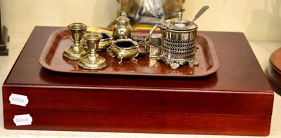 Lot 295 - A group of silver items to include salts, a pair of dwarf candlesticks and commemorative napkin...