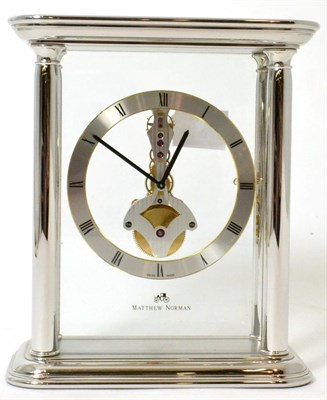 Lot 324 - A silvered brass mantel timepiece, signed Matthew Norman with box and booklet