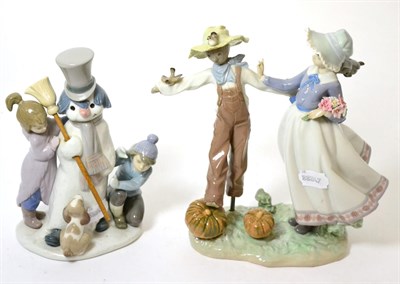 Lot 331 - A Lladro figure group of a Snowman and two children, 5713; together with a Lladro figure group of a