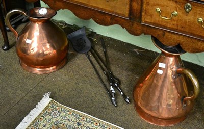 Lot 350 - Two 19th century copper harvest jugs together with a set of three iron fire tools