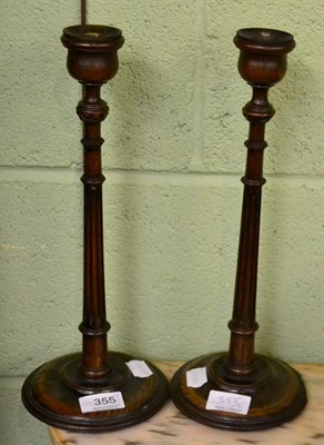 Lot 355 - A pair of Regency candlesticks with fluted uprights