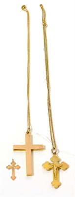 Lot 365 - A 9ct gold crucifix pendant on 9ct gold chain, a cross pendant on chain and another cross...