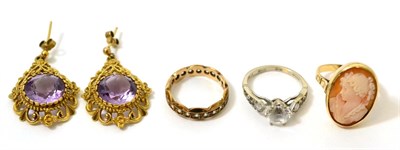 Lot 368 - An 18ct gold cubic zirconia ring, a pair of amethyst earrings, a cameo ring and an eternity ring