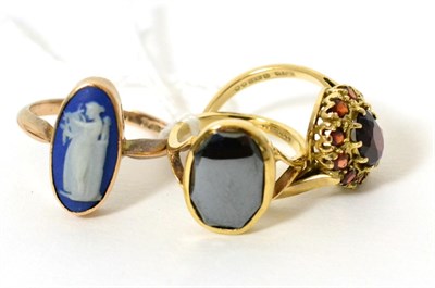 Lot 383 - A 9ct gold Wedgwood ring, finger size L1/2, a 9ct gold hematite ring and a 9ct gold garnet ring (3)