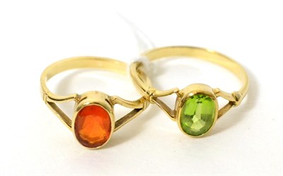 Lot 388 - A 9ct gold fire opal ring, finger size M and a 9ct gold peridot ring, finger size P1/2 (2)