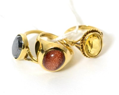 Lot 390 - A 9ct gold goldstone signet ring, finger size L, a 9ct gold hematite ring and a 9ct gold...