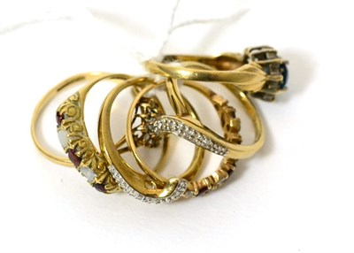 Lot 393 - A 9ct gold diamond double band ring set, finger size N and four other 9ct gold gem set rings (5)